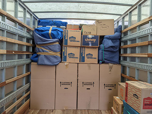 Fully packed and loaded Broad Street Movers truck, ready to travel for a long-distance move