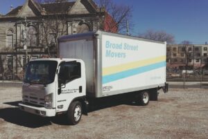 A moving truck from Broad Street Movers parked in front of a home in Philadelphia, PA